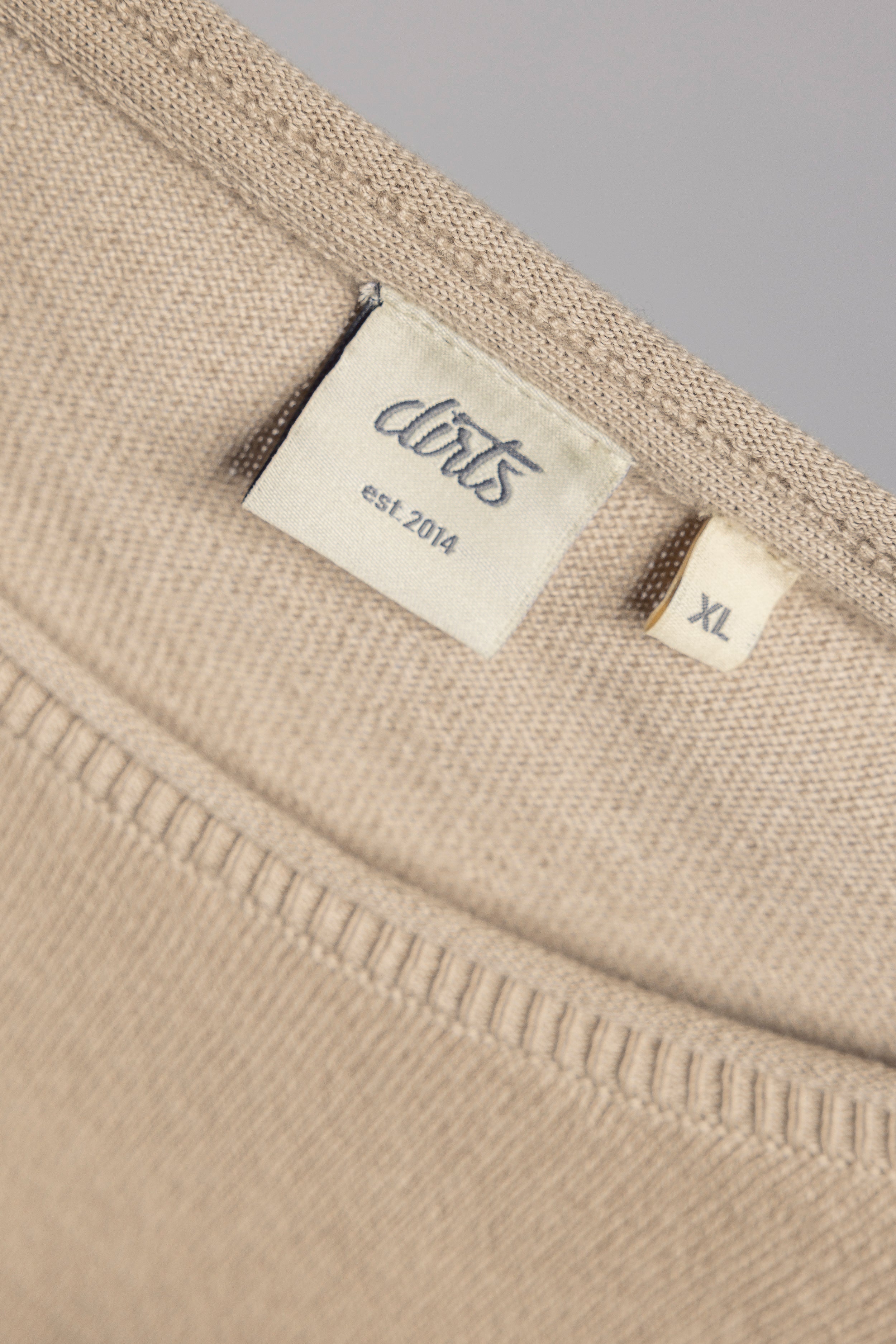 Beige knitted long-sleeve sweater made of 100% organic cotton from DIRTS