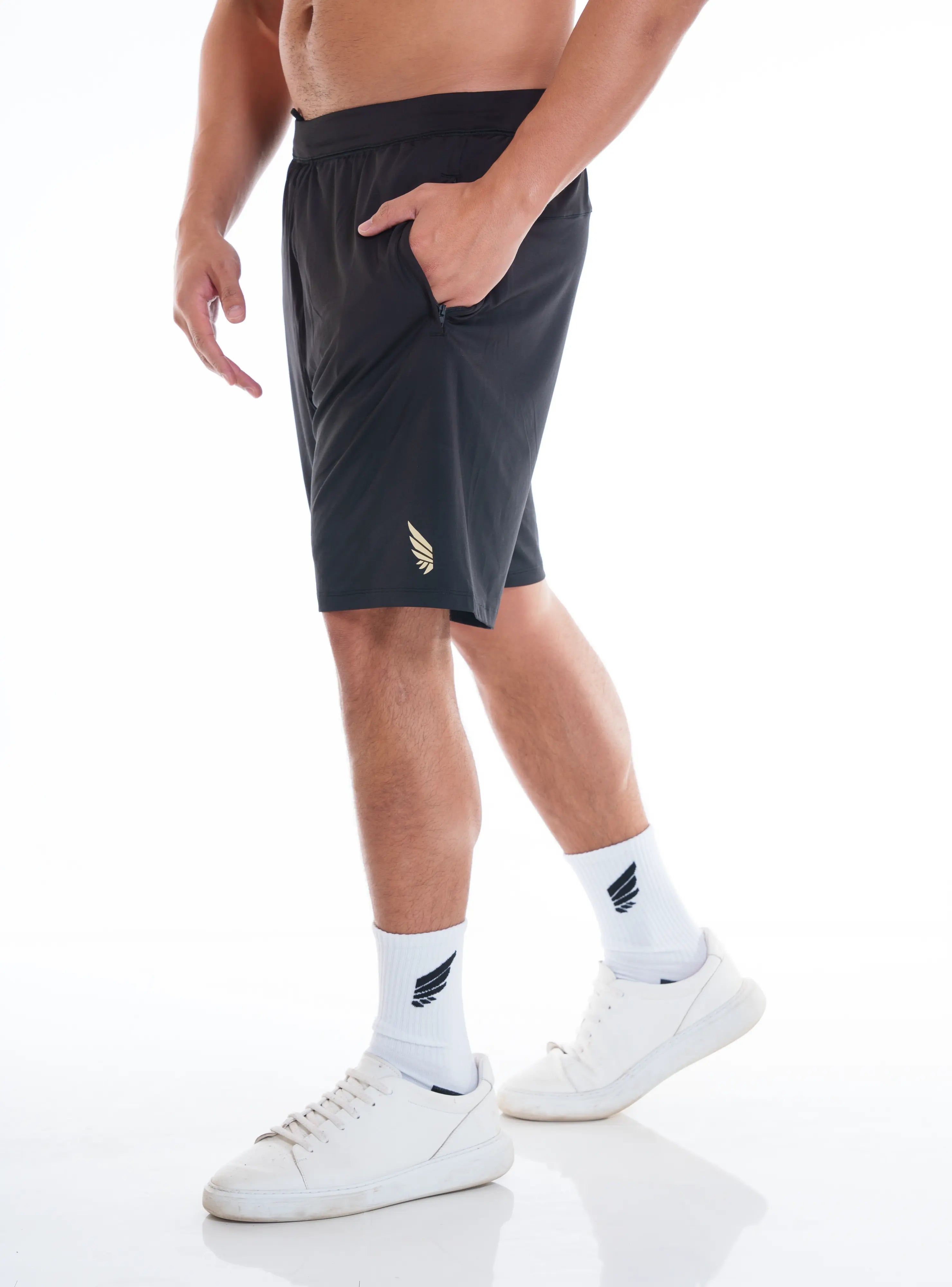 NIVɅYS ® hand in pocket zeyla performance shorts obsidian black side view