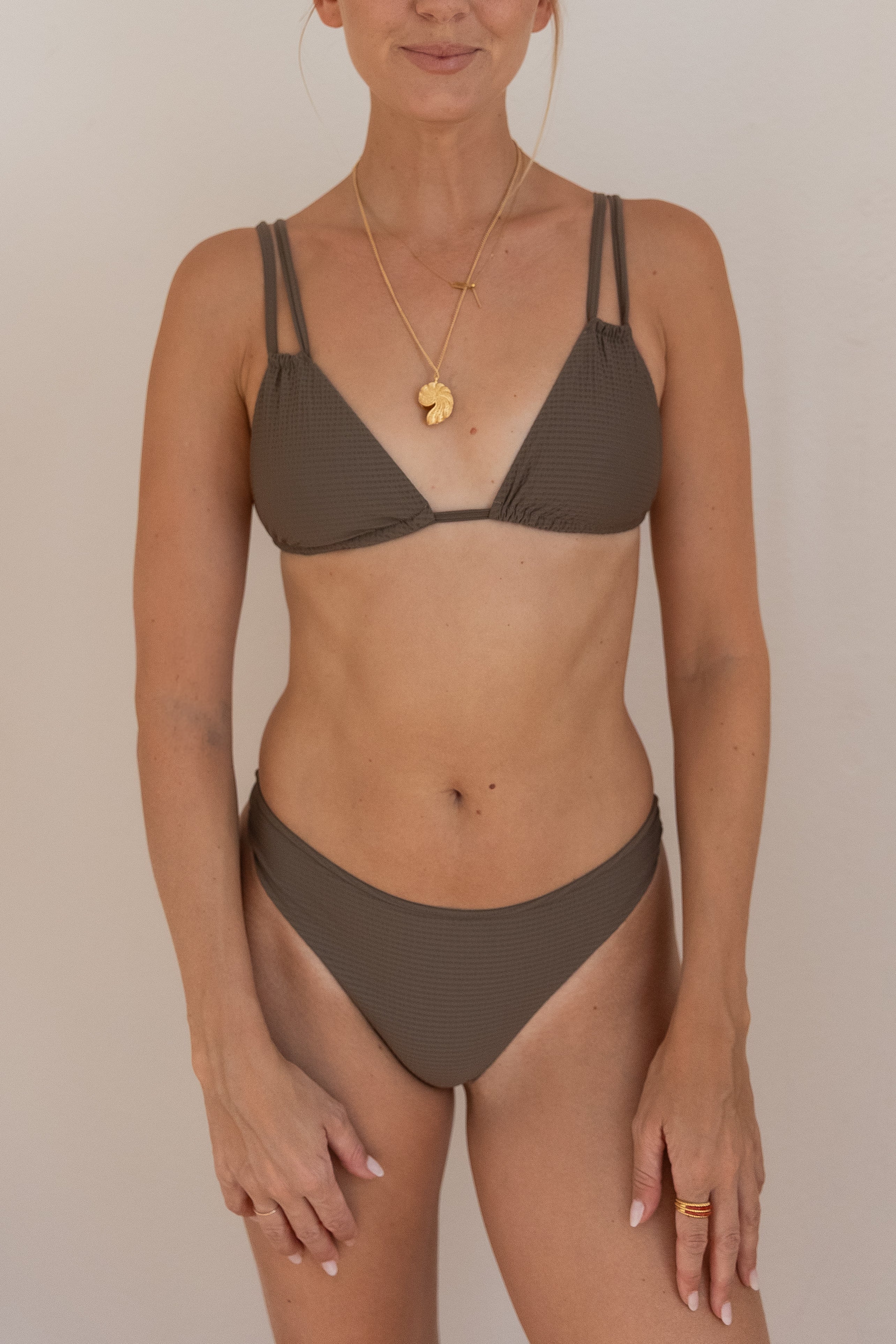 Brown LAALA bikini bottoms made from recycled polyamide by Pura Clothing