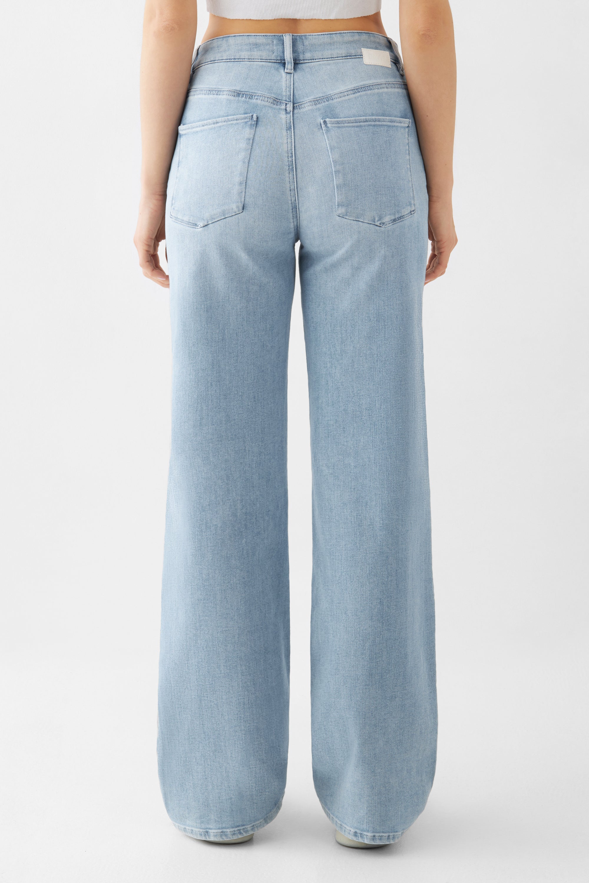 Light blue DEW Flared jeans made from organic cotton by Dawn Denim