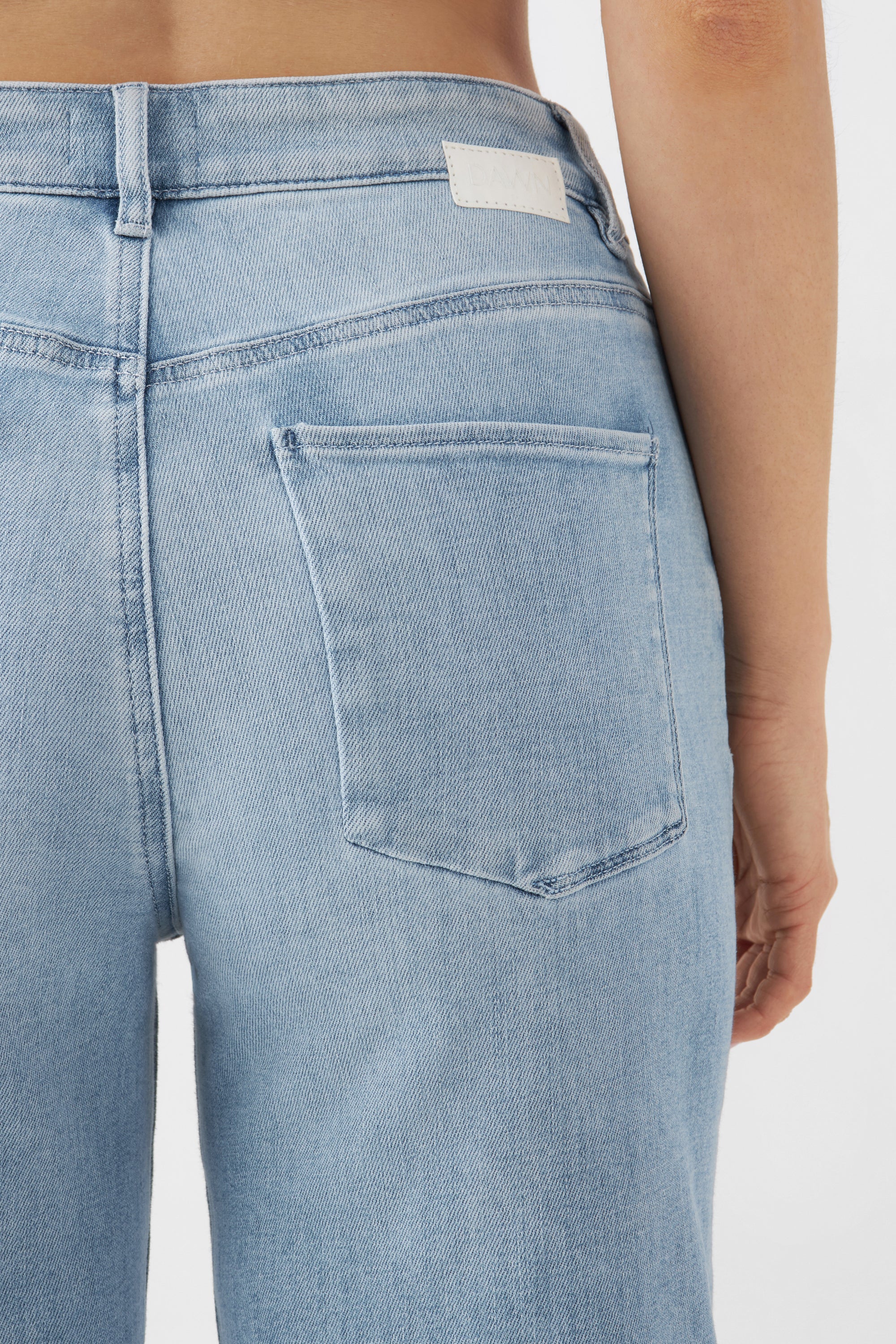 Light blue DEW Flared jeans made from organic cotton by Dawn Denim