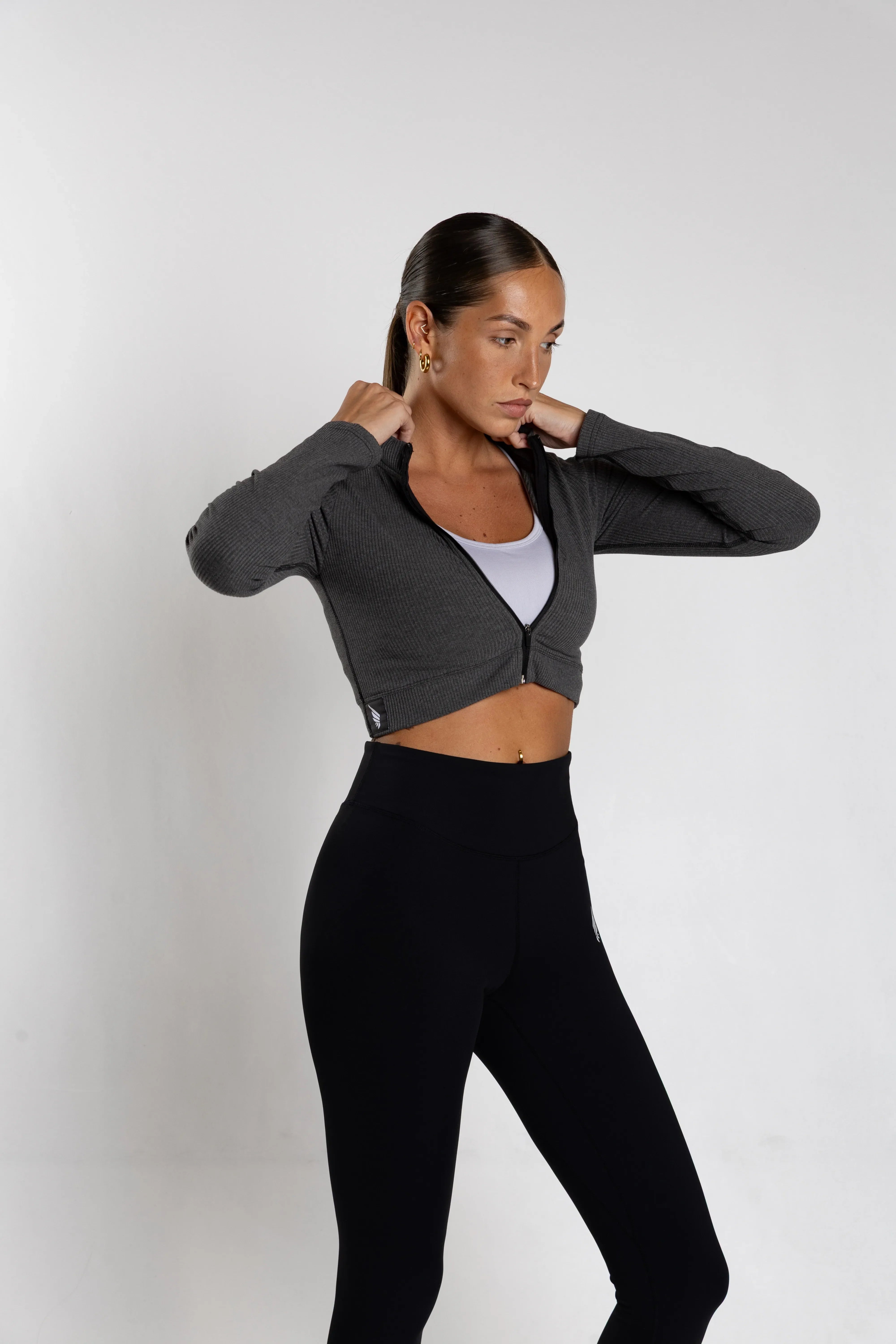 NIVɅYS performance clothing, highlighting the modern fit and sustainable recycled materials.
