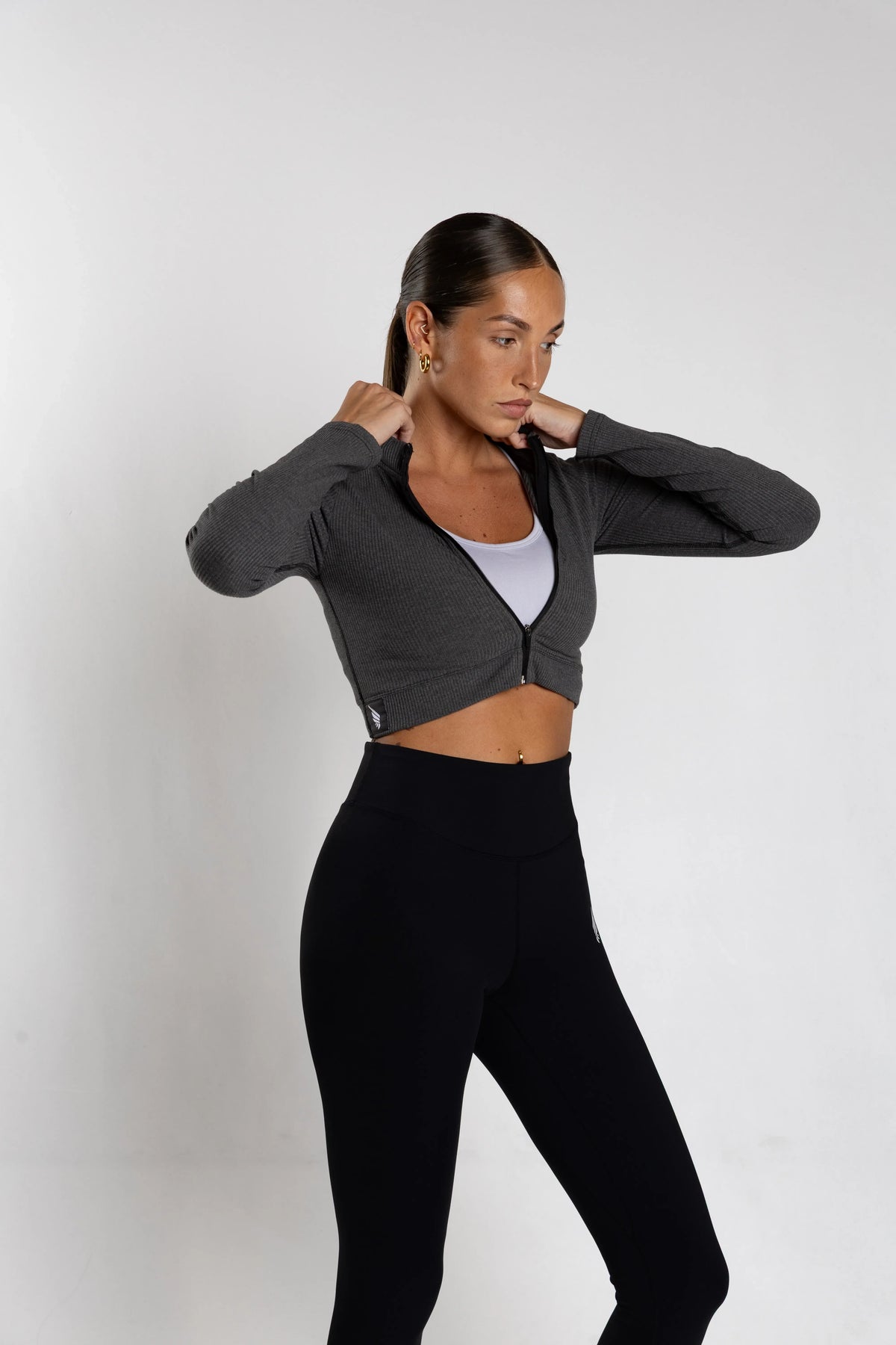 NIVɅYS performance clothing, highlighting the modern fit and sustainable recycled materials.