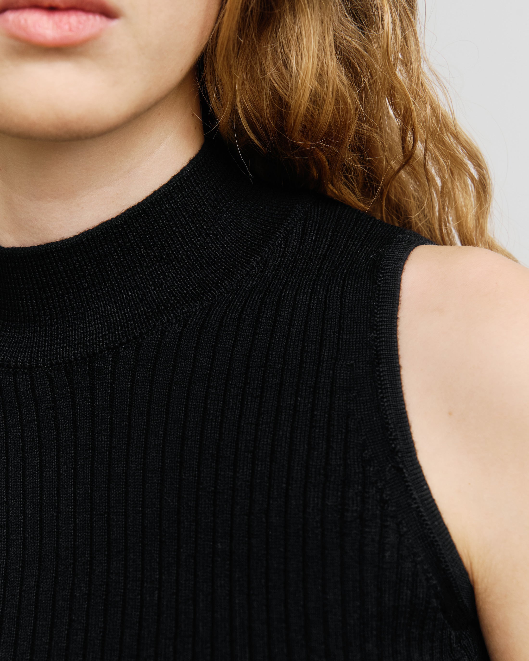 Black Knitted Singlet Top Made of 100% Merino Wool by Rotholz