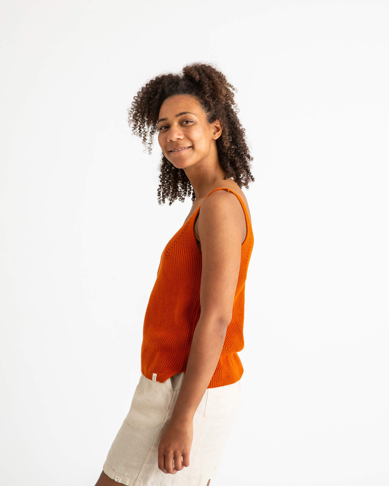 Orange, knitted tank top made from 100% organic cotton by Matona