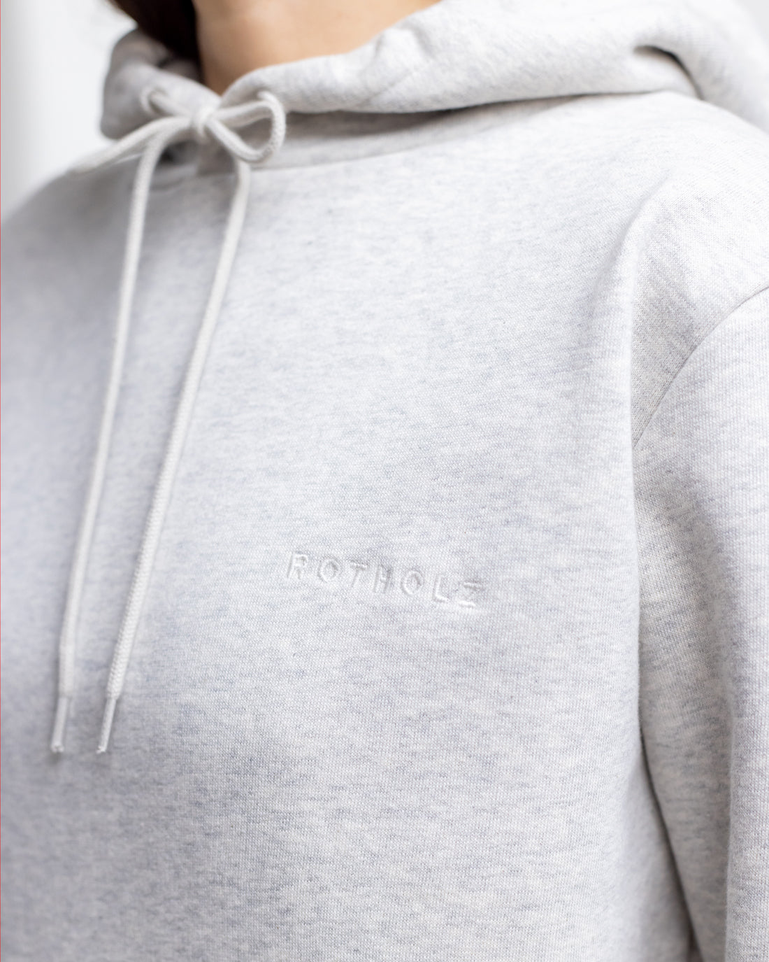 Light gray hoodie logo made of 100% organic cotton from Rotholz