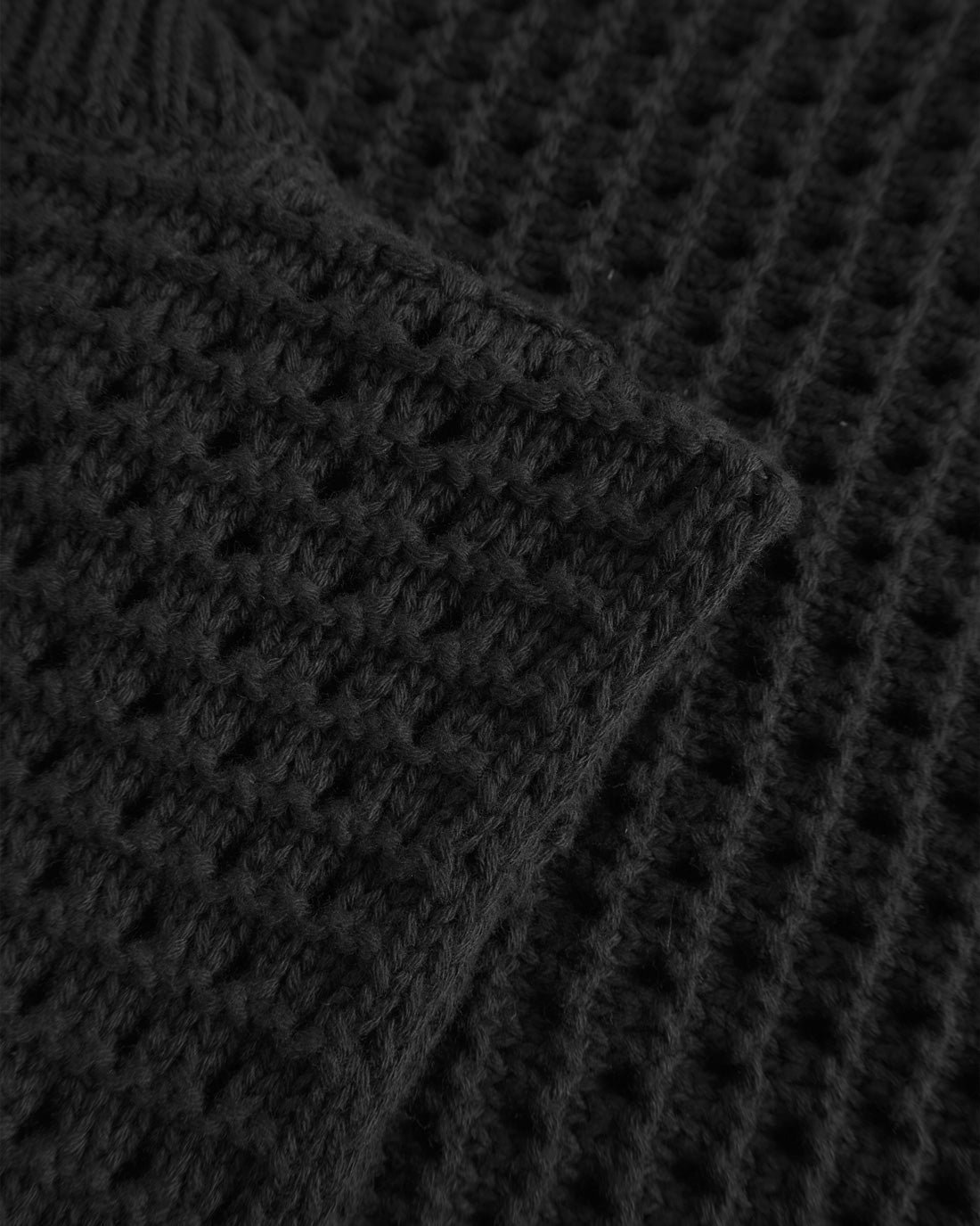 Black knitted vest made of 100% organic cotton by Rotholz