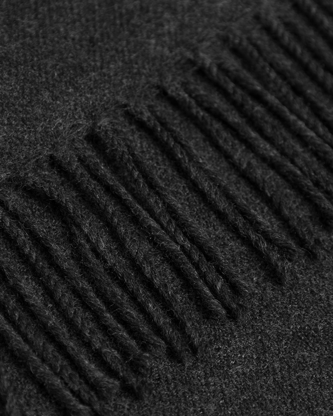 Black woven scarf made of 100% merino wool by Rotholz