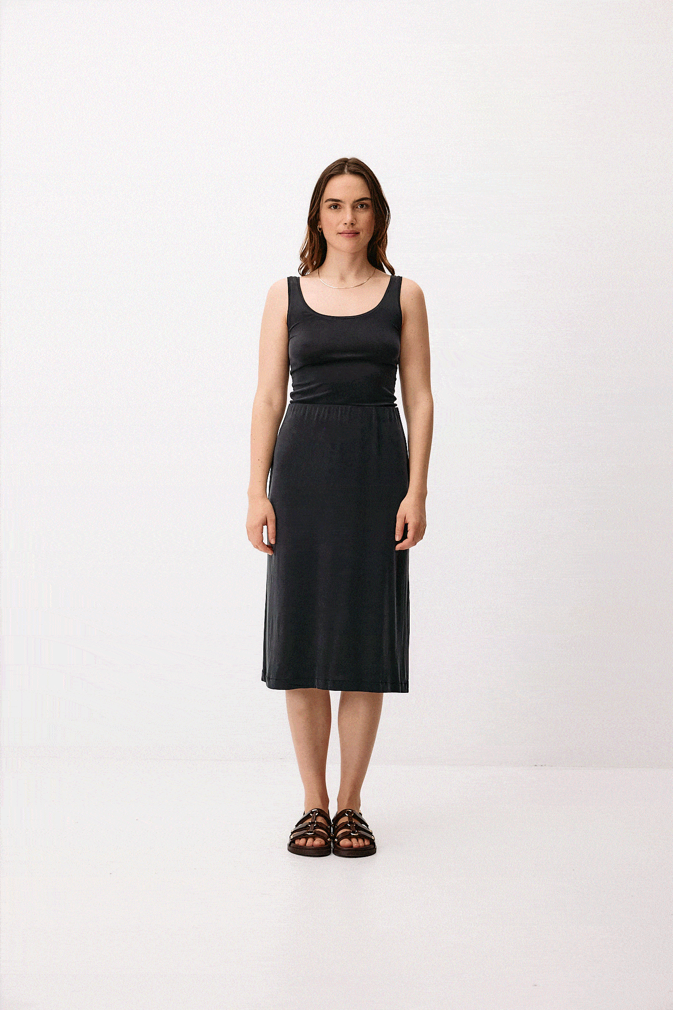 Black cupro midi skirt by Moya Kala