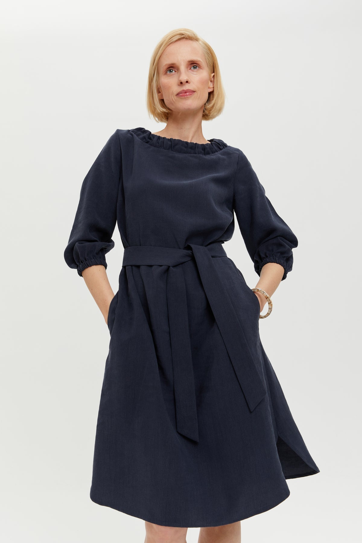 Celine | Elegant belted dress with cutout element in dark blue by Ayani
