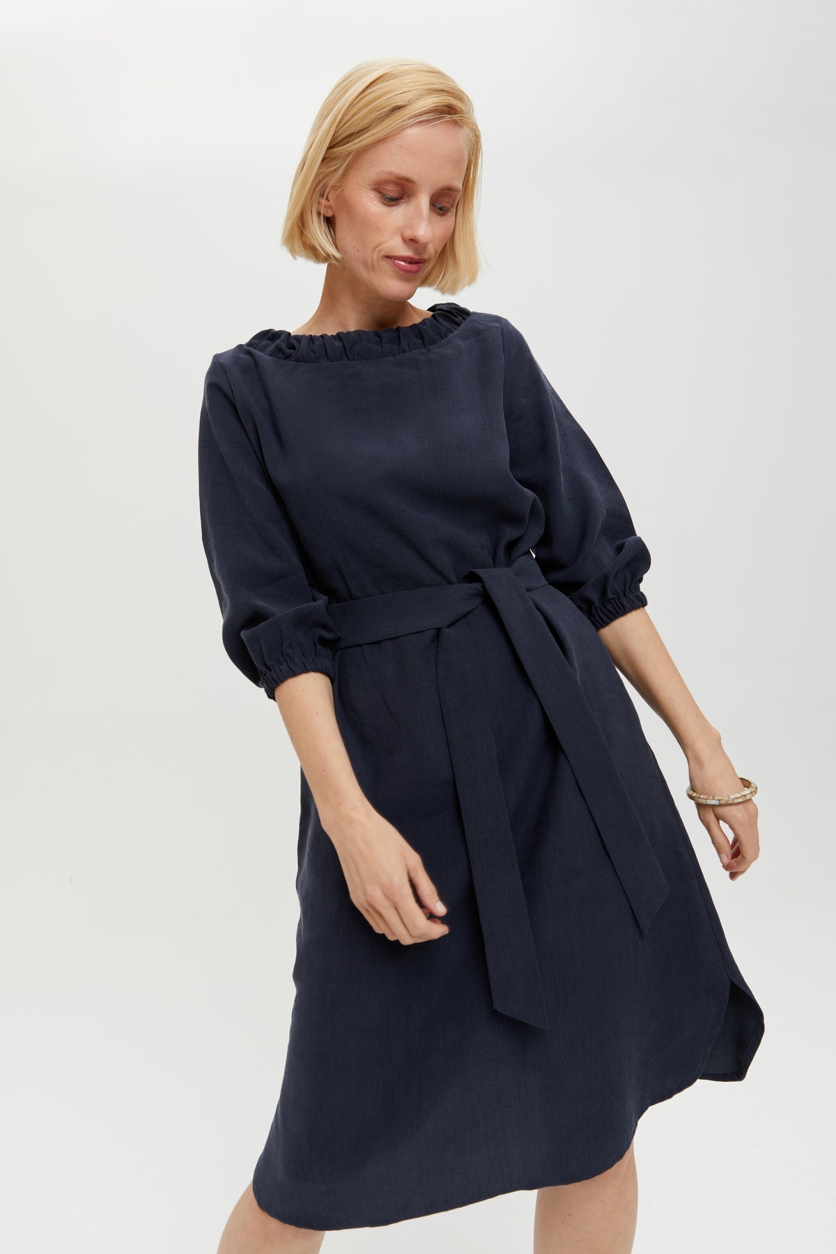 Celine | Elegant belted dress with cutout element in dark blue by Ayani