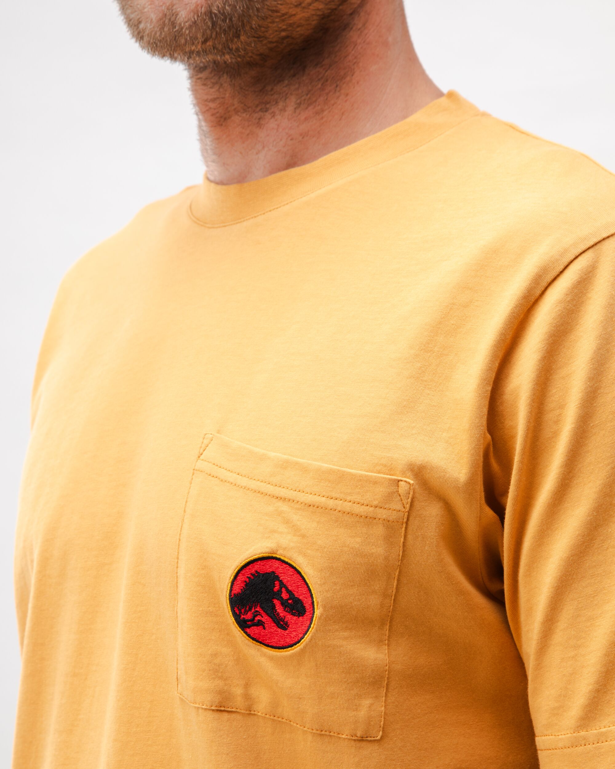 T-shirt orange avec logo Jurassic Park en coton biologique de Brava Fabrics