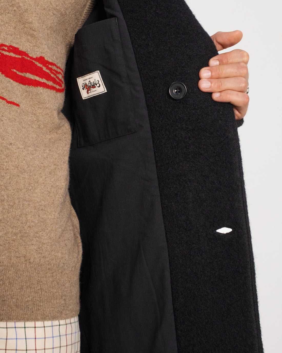 Black organic wool coat from Rotholz