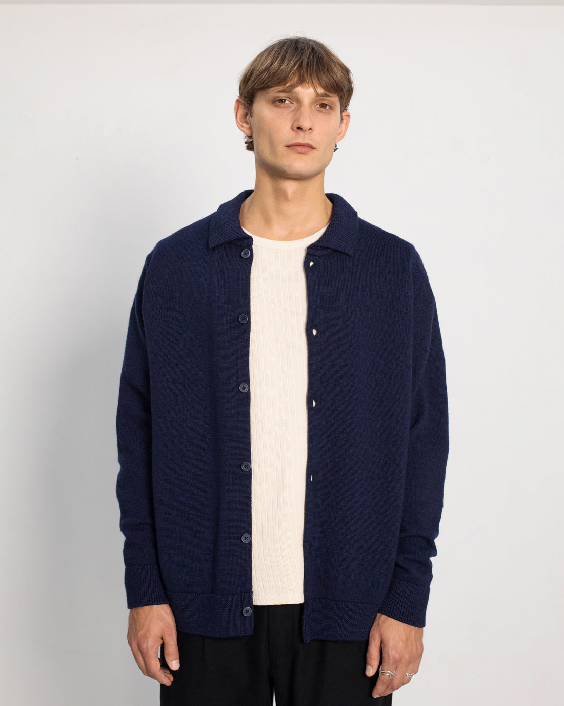 Blue cardigan made of 100% merino wool by Rotholz