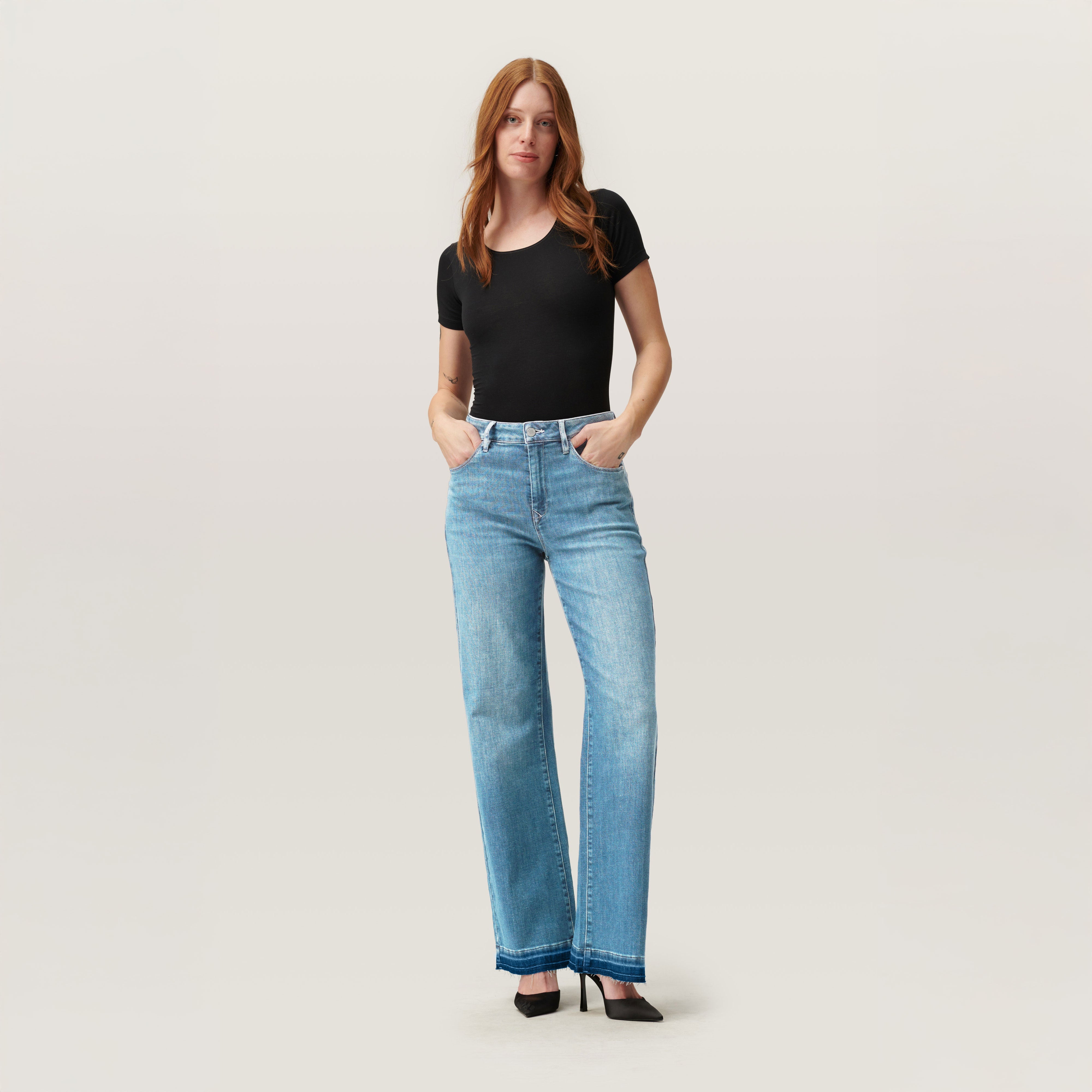 Light blue DEW Flared jeans made from organic cotton by Dawn Denim