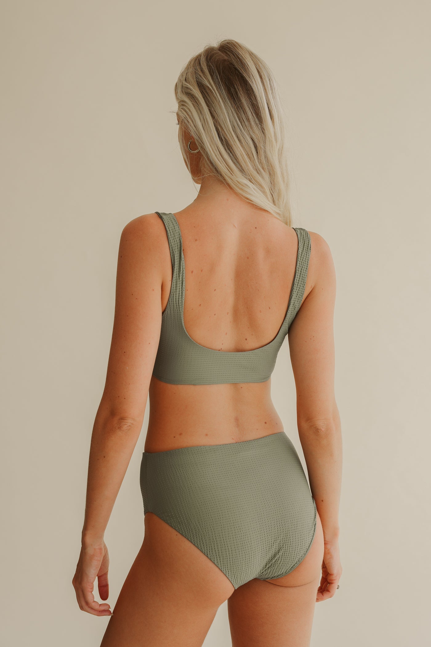 Green bikini top LIIA made from recycled polyamide by Pura Clothing