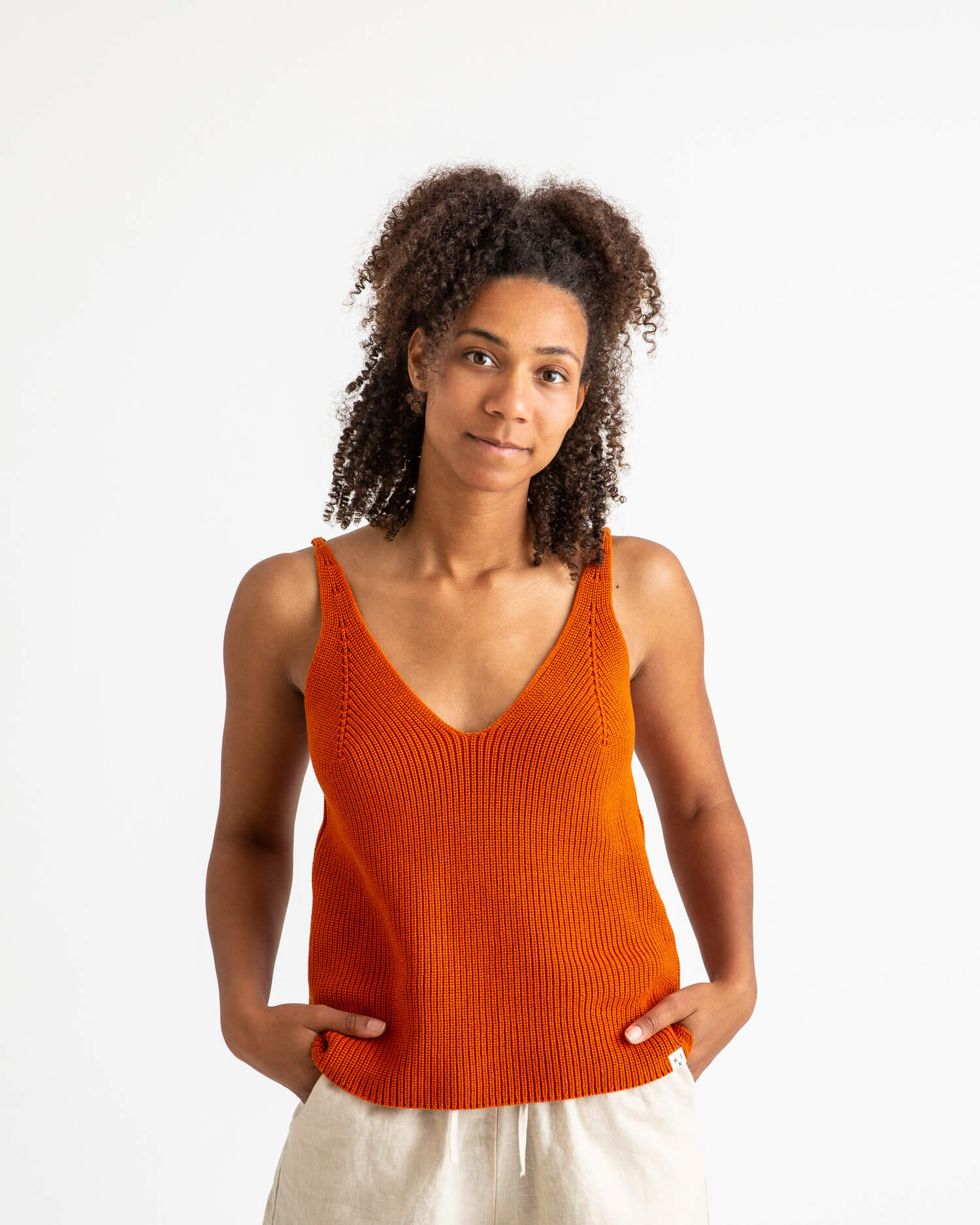 Orange, knitted tank top made from 100% organic cotton by Matona