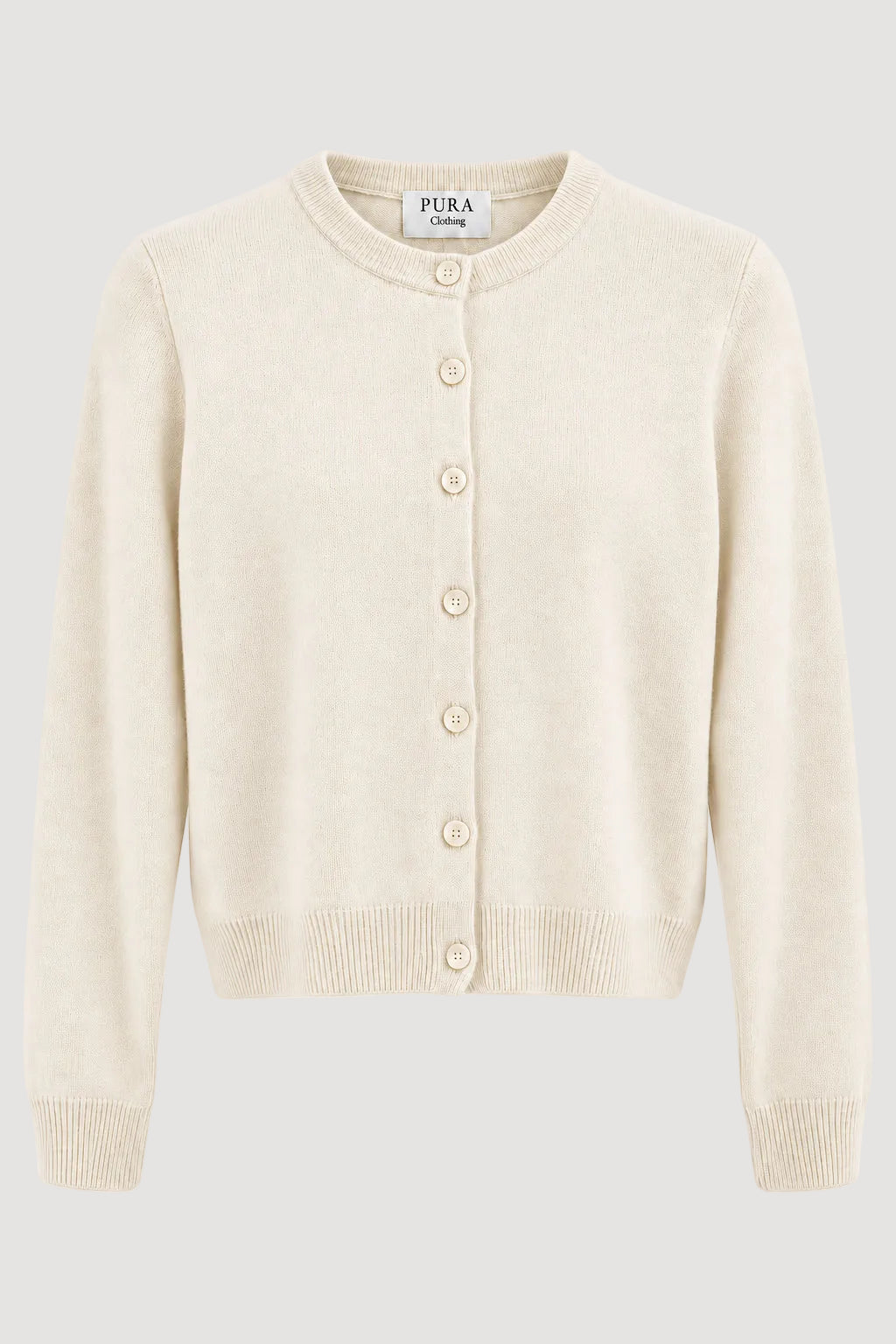 Weisse Strickjacke aus 100% Merinowolle von Pura Clothing