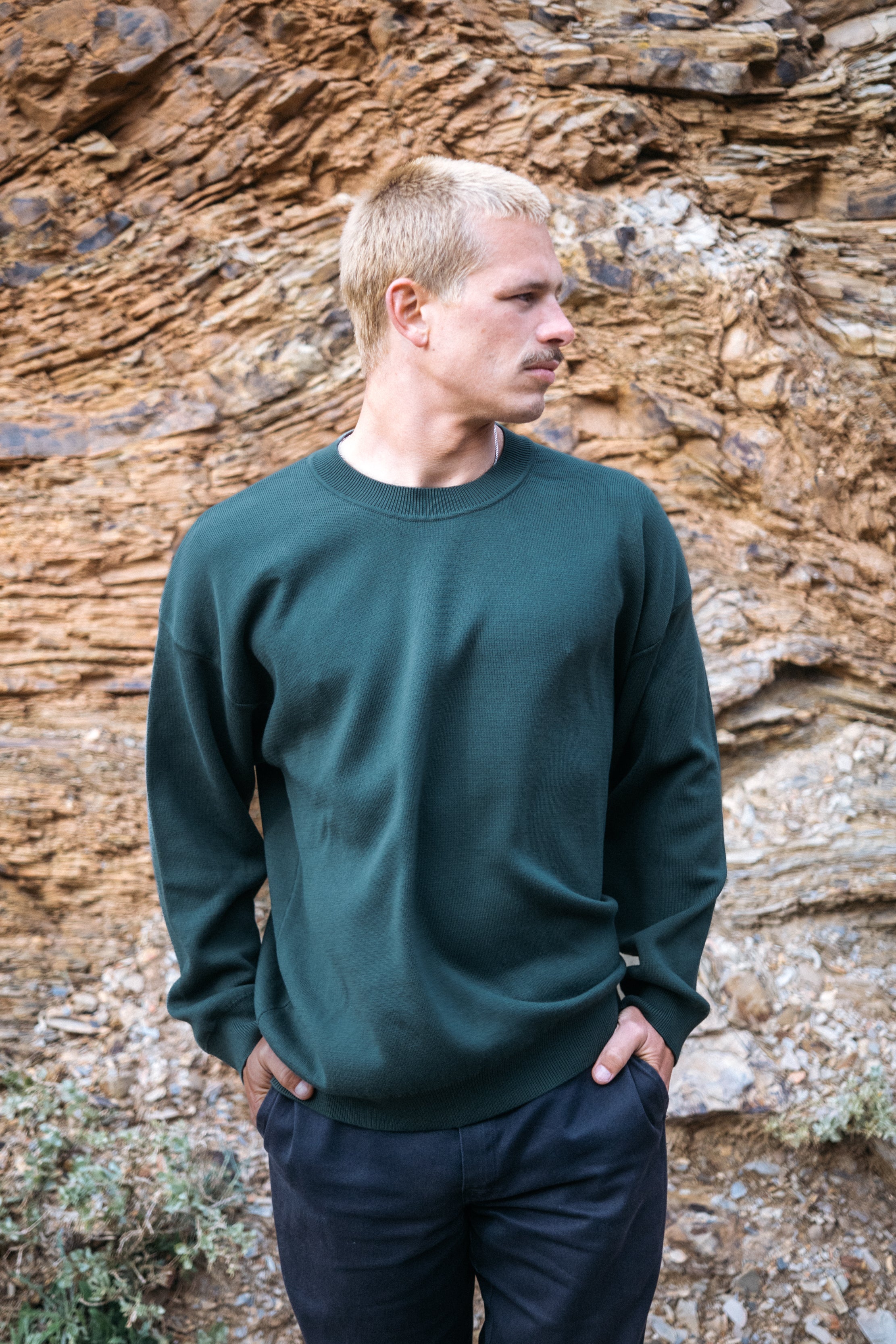 Dark green knitted sweater made from 100% organic cotton by Salzwasser