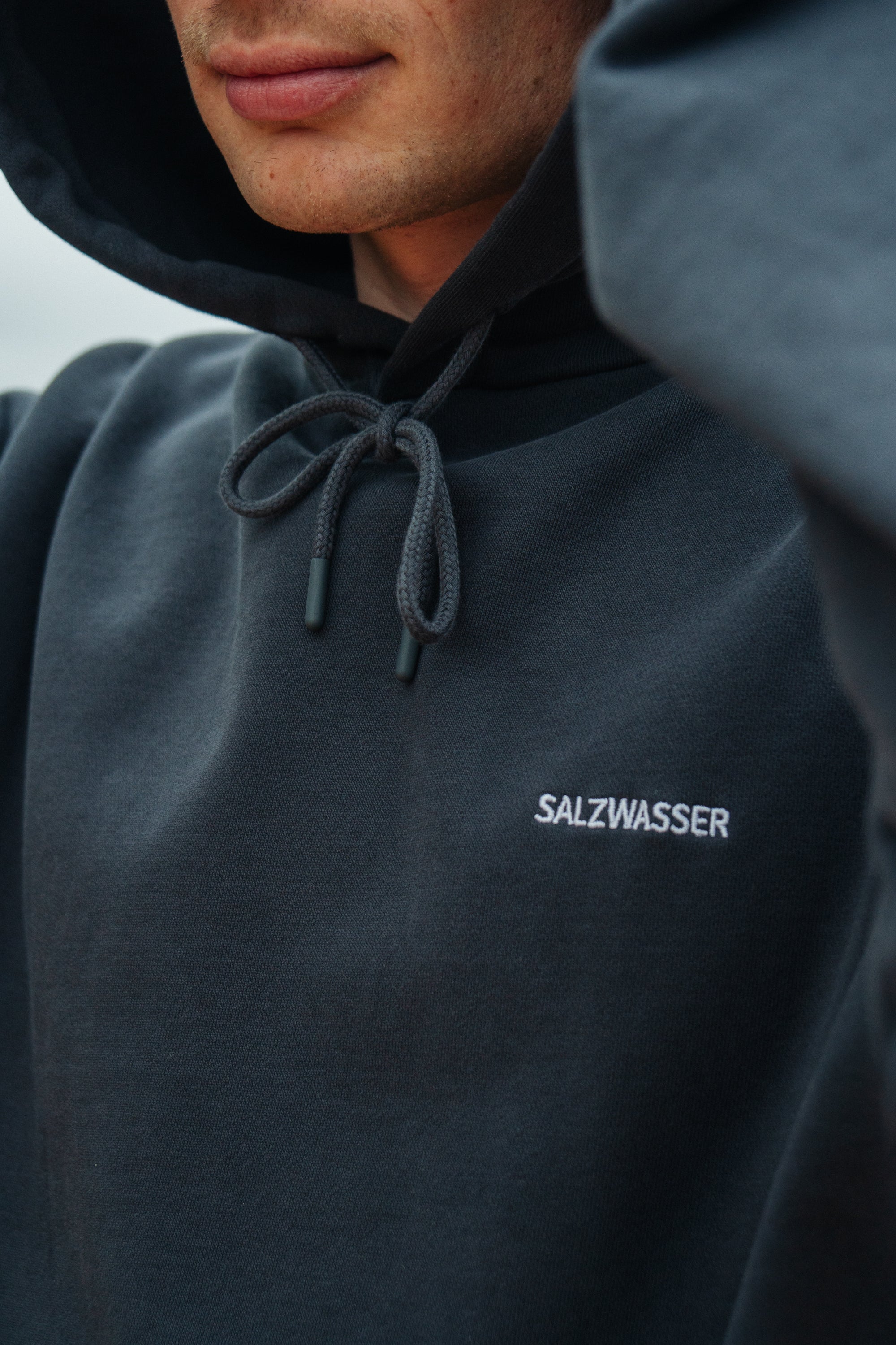 Grey-blue hoodie cape made of organic cotton by Salzwasser