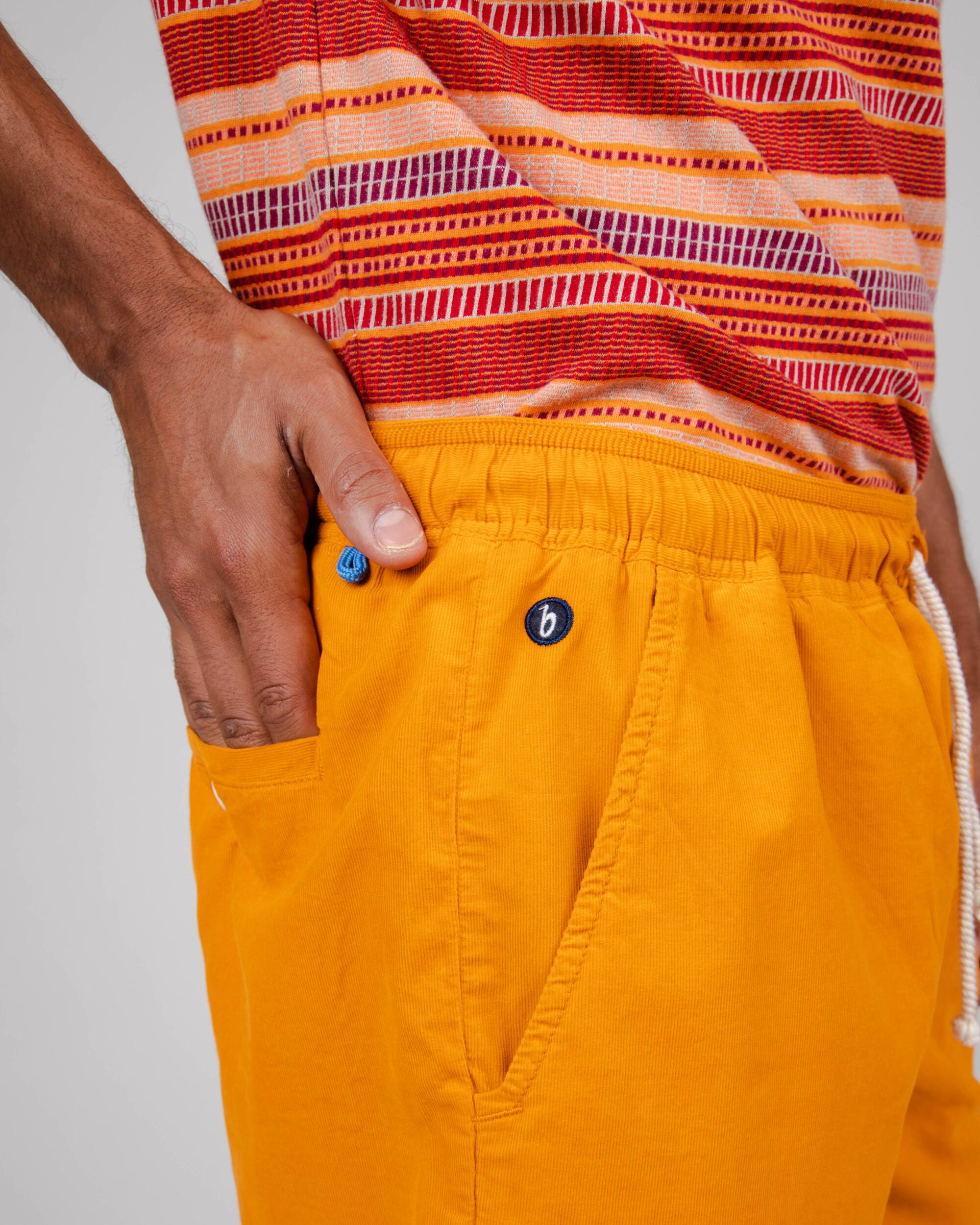 Orange baby corduroy shorts made from 100% organic cotton from Brava Fabrics