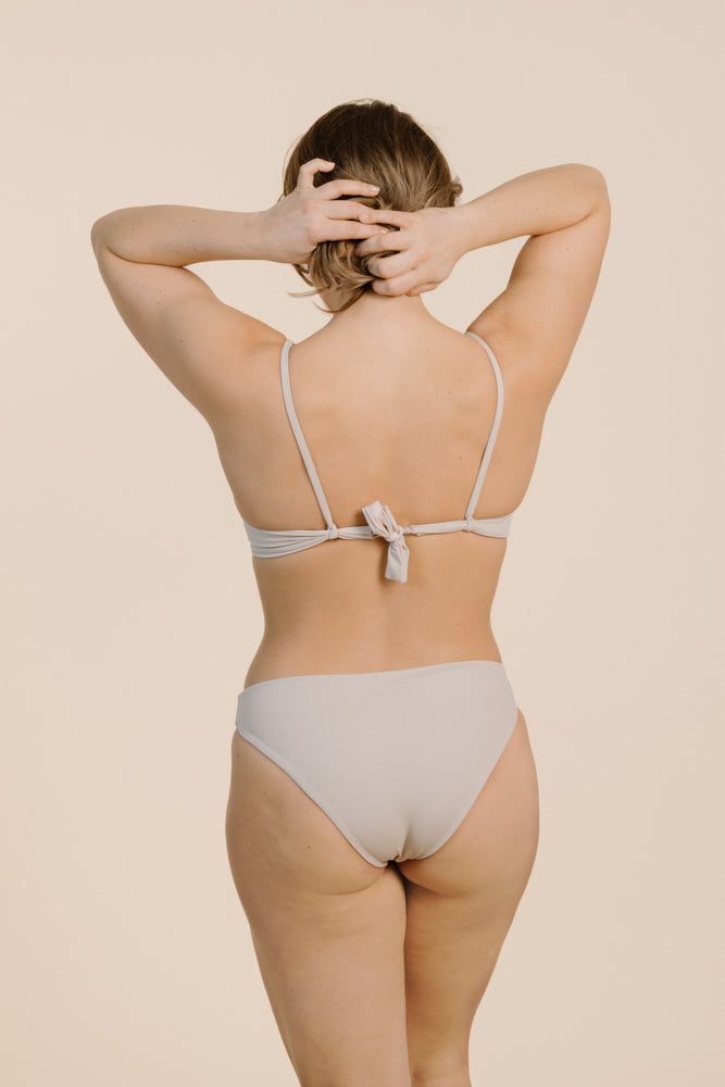 Powder-colored bikini top OLEA made from recycled polyamide from PURA Clothing