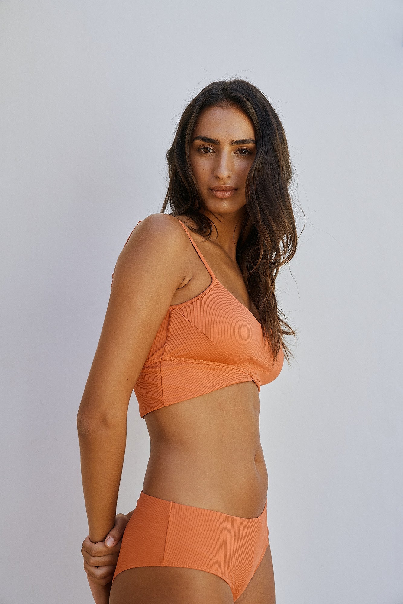 Orange bikini top hybrid made of recycled polyamide from MOYA KALA