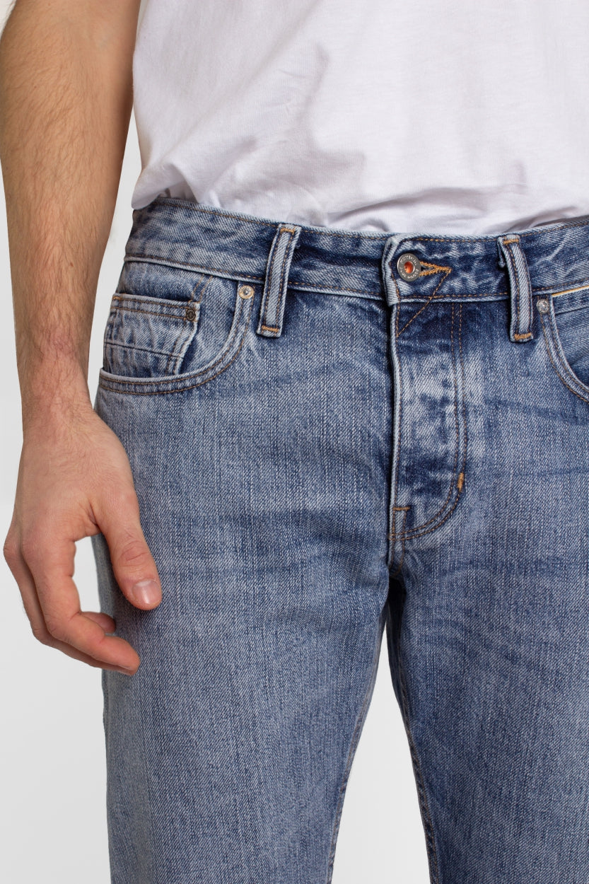 Jim jeans in blue made of organic cotton and recycled denim with orange seams from Kuyichi