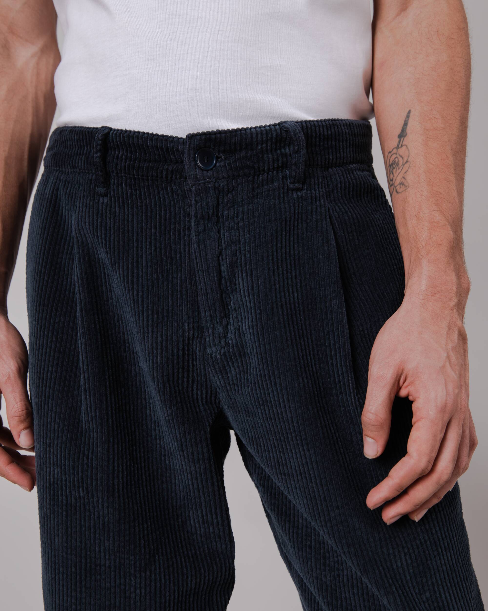 Navy corduroy pleated trousers made from organic cotton by Brava Fabrics