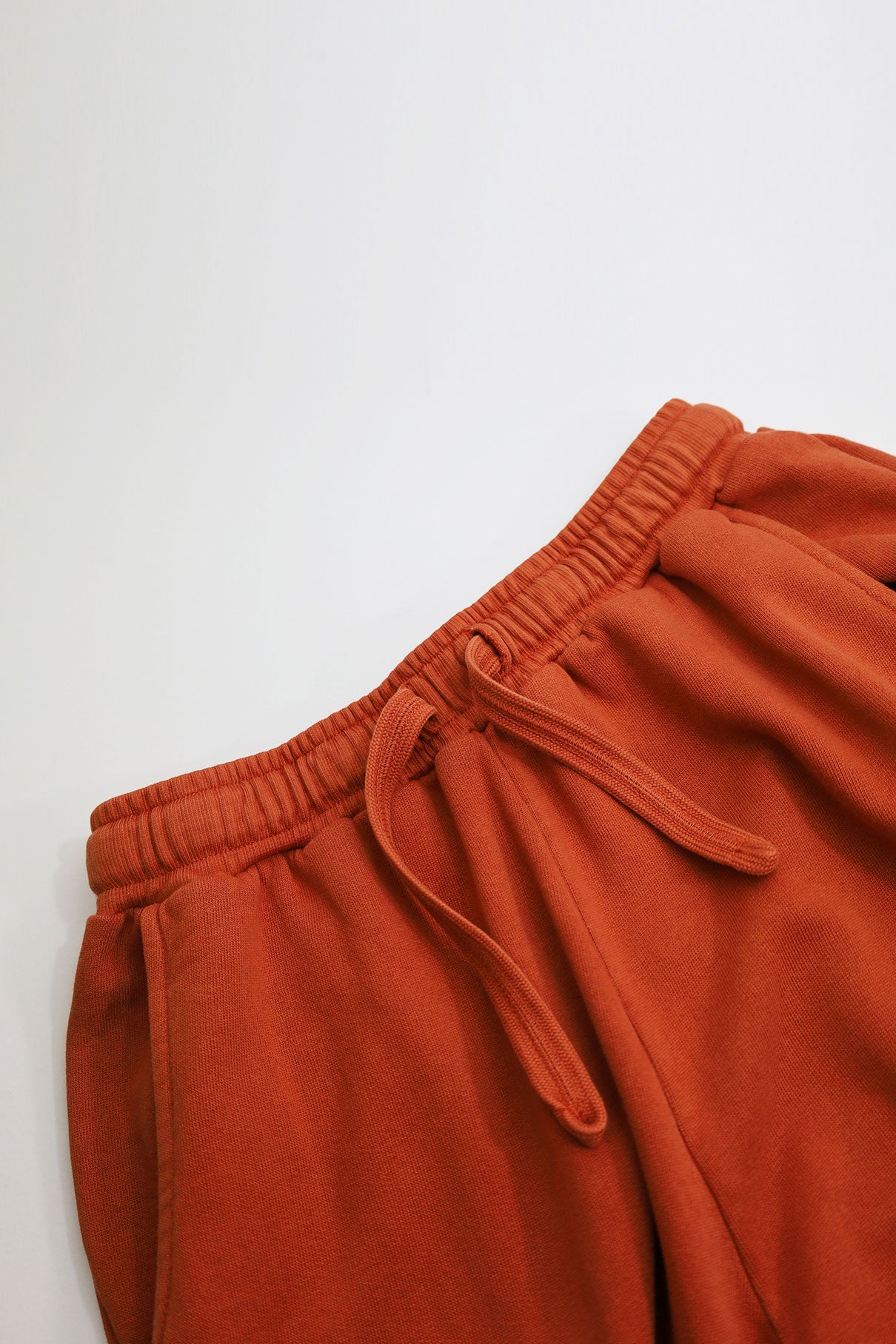 Dark orange ADAM jogging pants made of organic cotton by Komodo