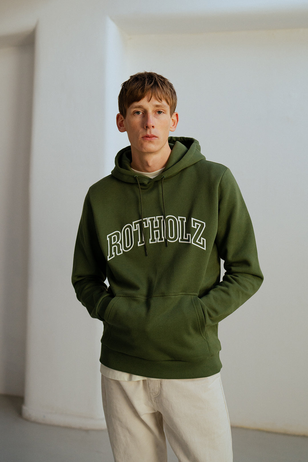Dark green hoodie made of organic cotton from Rotholz