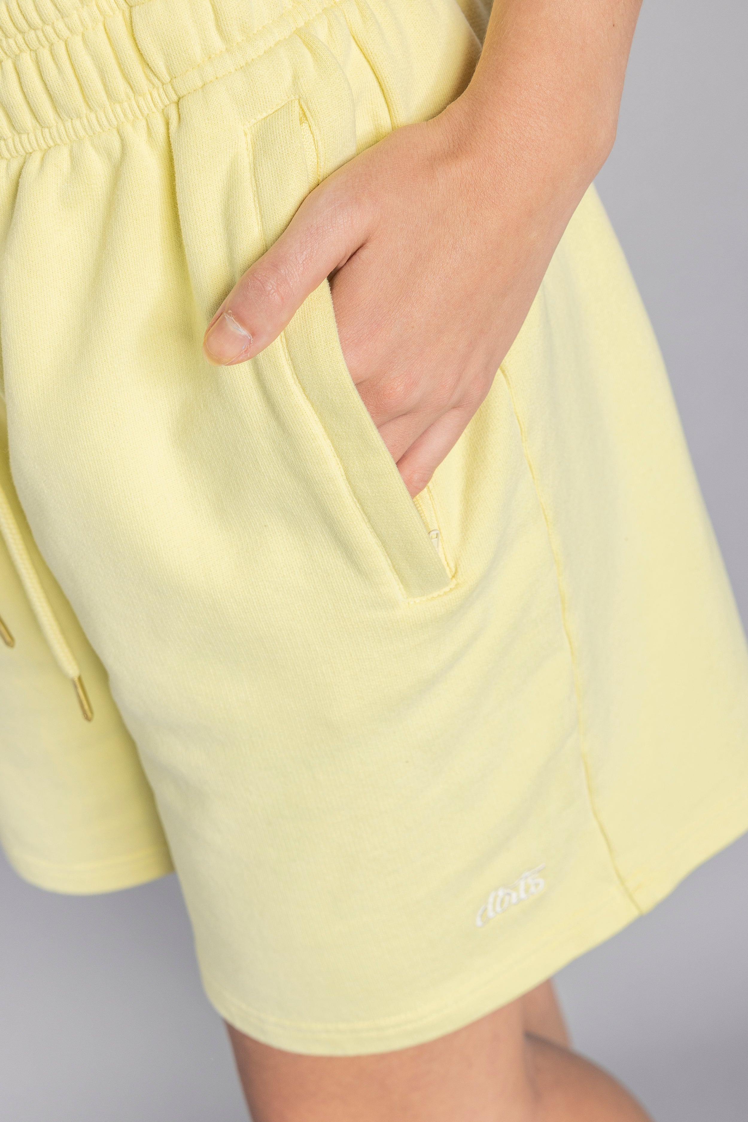 Yellow sweat shorts made from 100% organic cotton from DIRTS