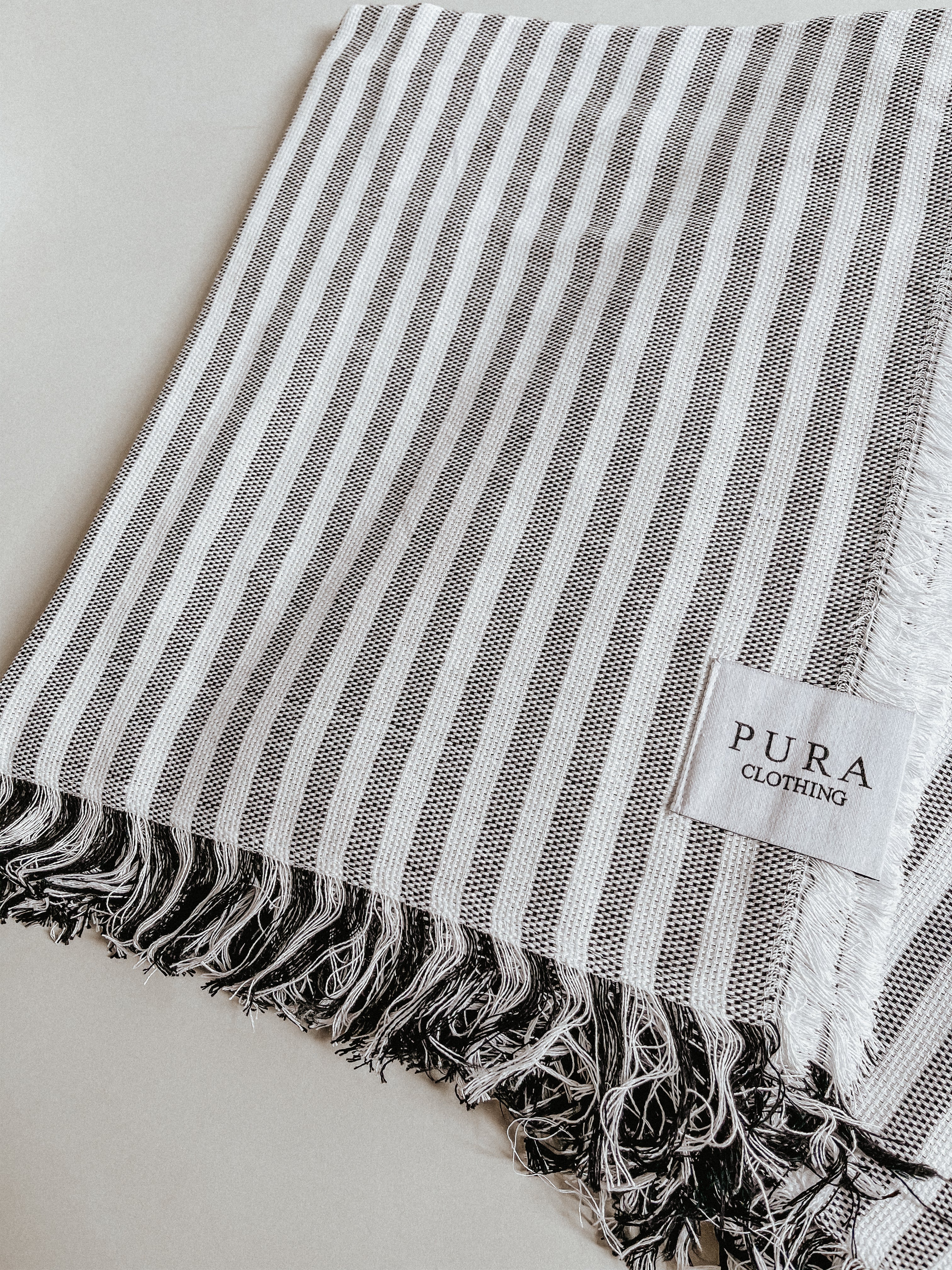 Striped beach towel made from 100% organic cotton from Pura Clothing
