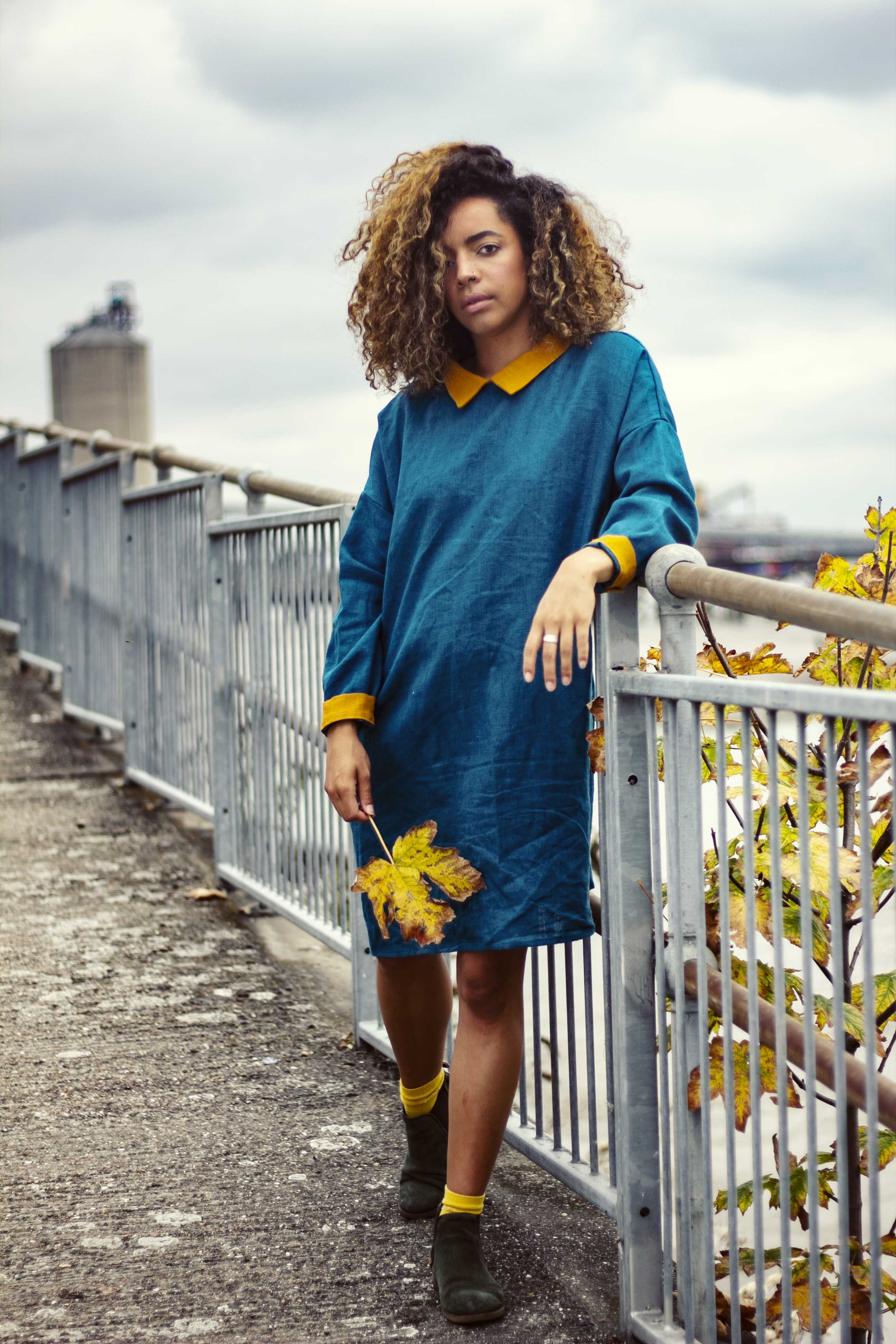 Classic, turquoise-blue dress with mustard-colored details made of 100% linen