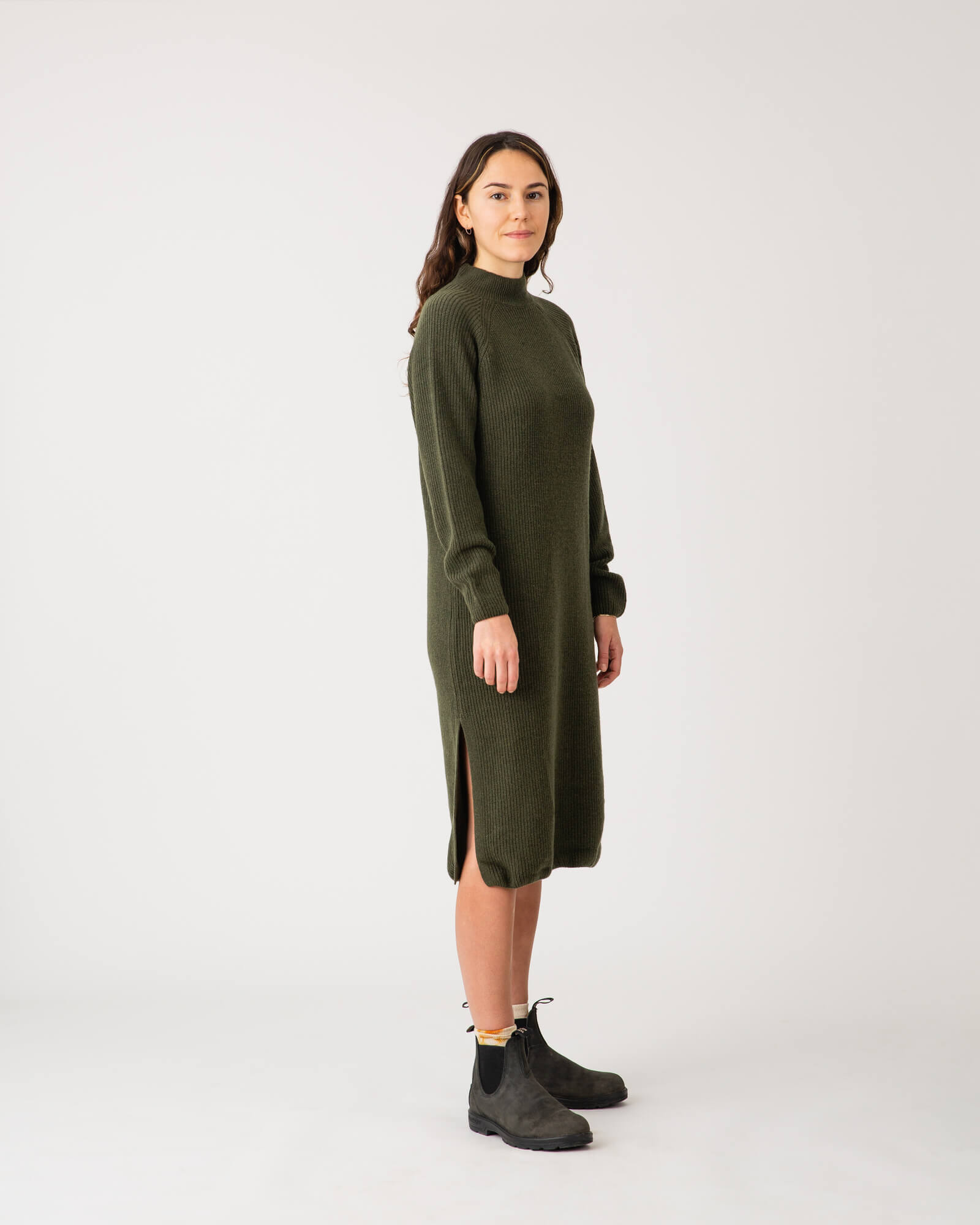 Dark green knitted loden dress made from recycled wool by Matona