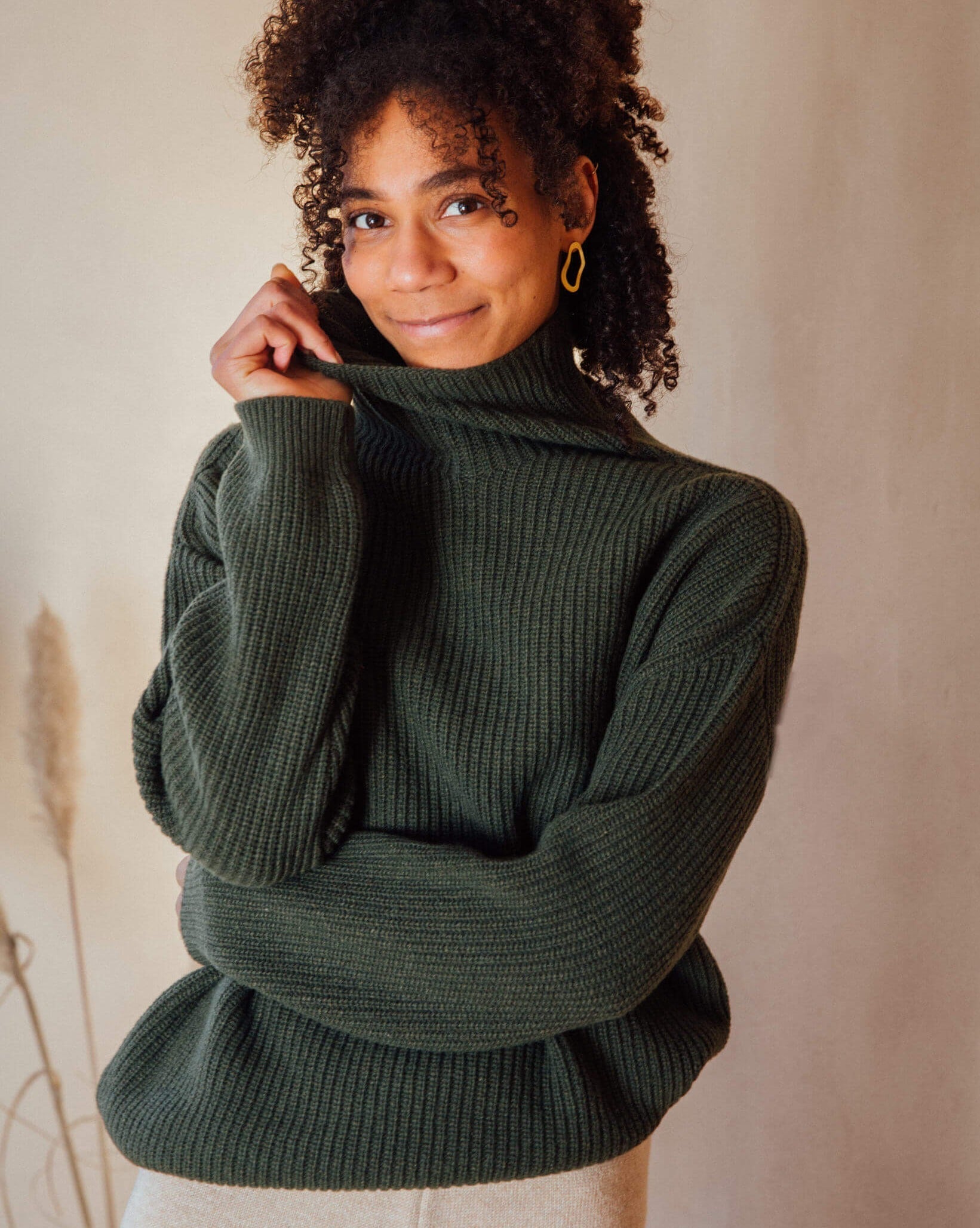 Loden green turtleneck sweater from Matona made from recycled wool blend