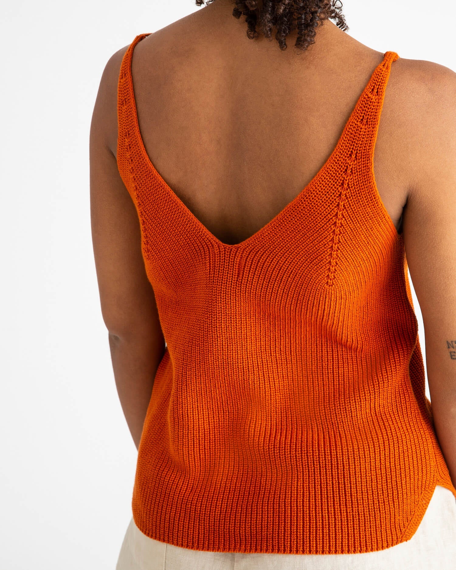 Orange, knitted tank top made from 100% organic cotton by Matona