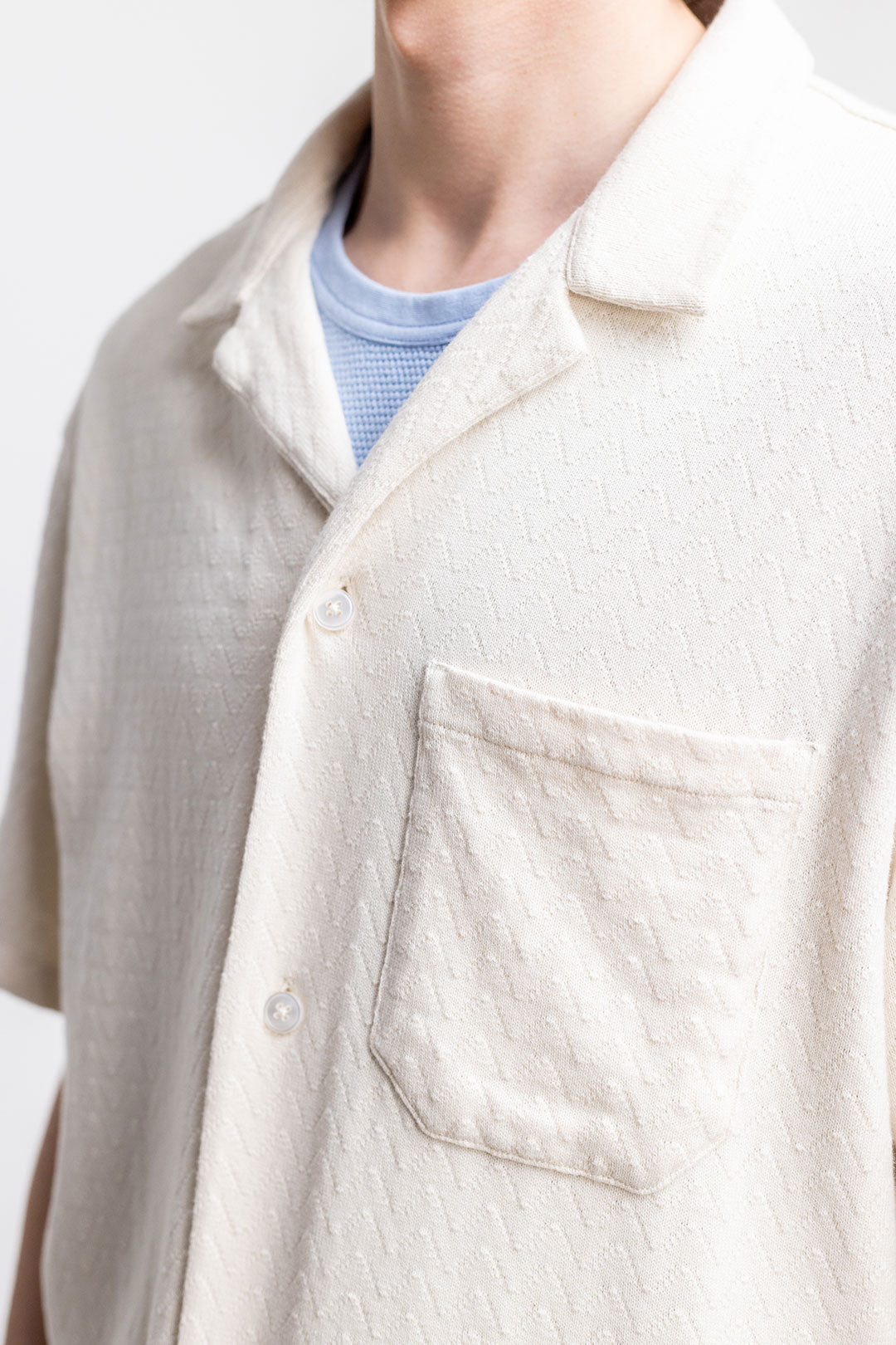 White knitted bowling shirt made from 100% organic cotton from Rotholz