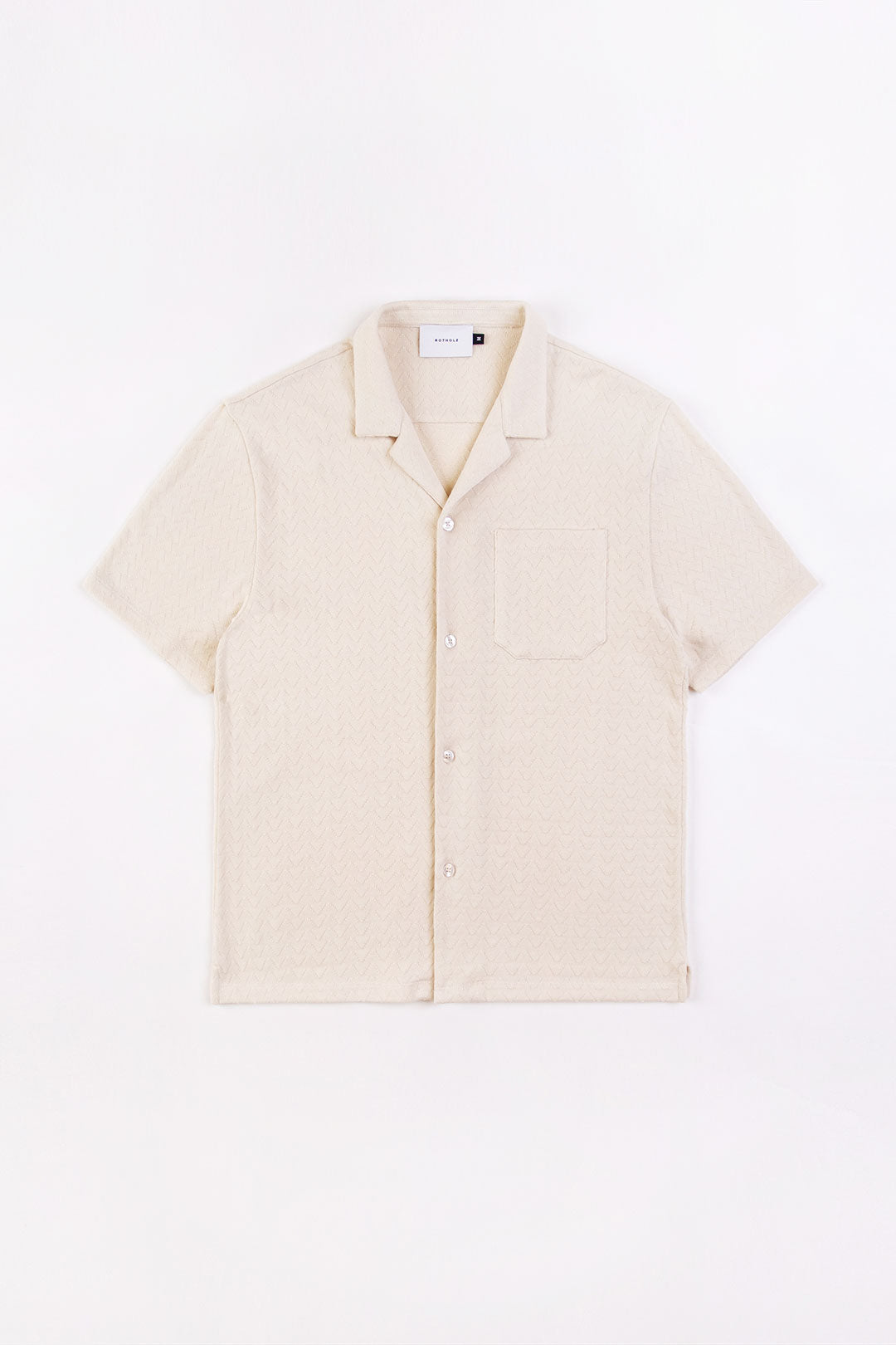 White knitted bowling shirt made from 100% organic cotton from Rotholz