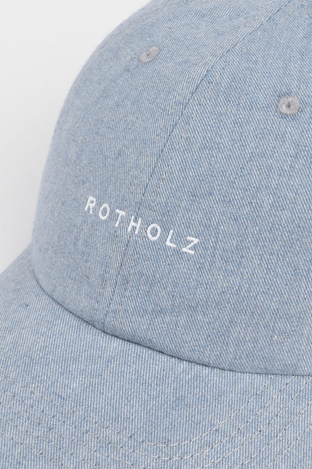 Blue-grey cap logo made of 100% organic cotton from Rotholz
