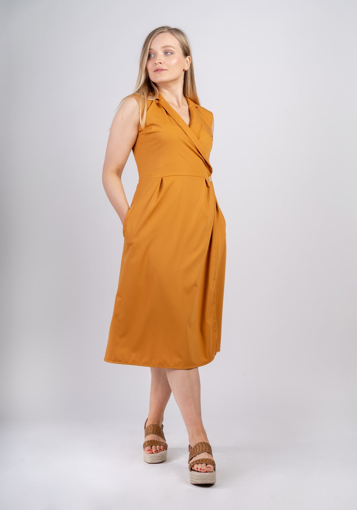 Yellow Sara sleeveless wrap dress made from recycled polyester by Ayani