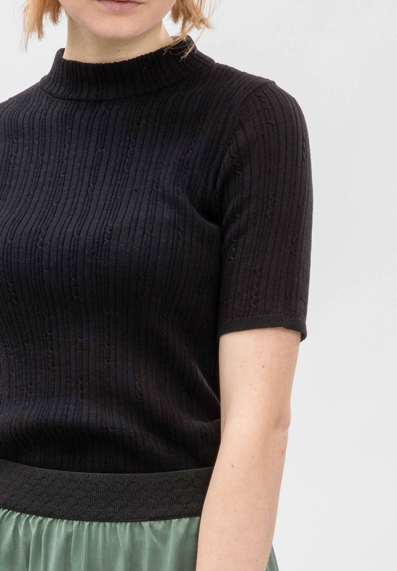 Knitted top IDALA in black by LOVJOI made of organic cotton