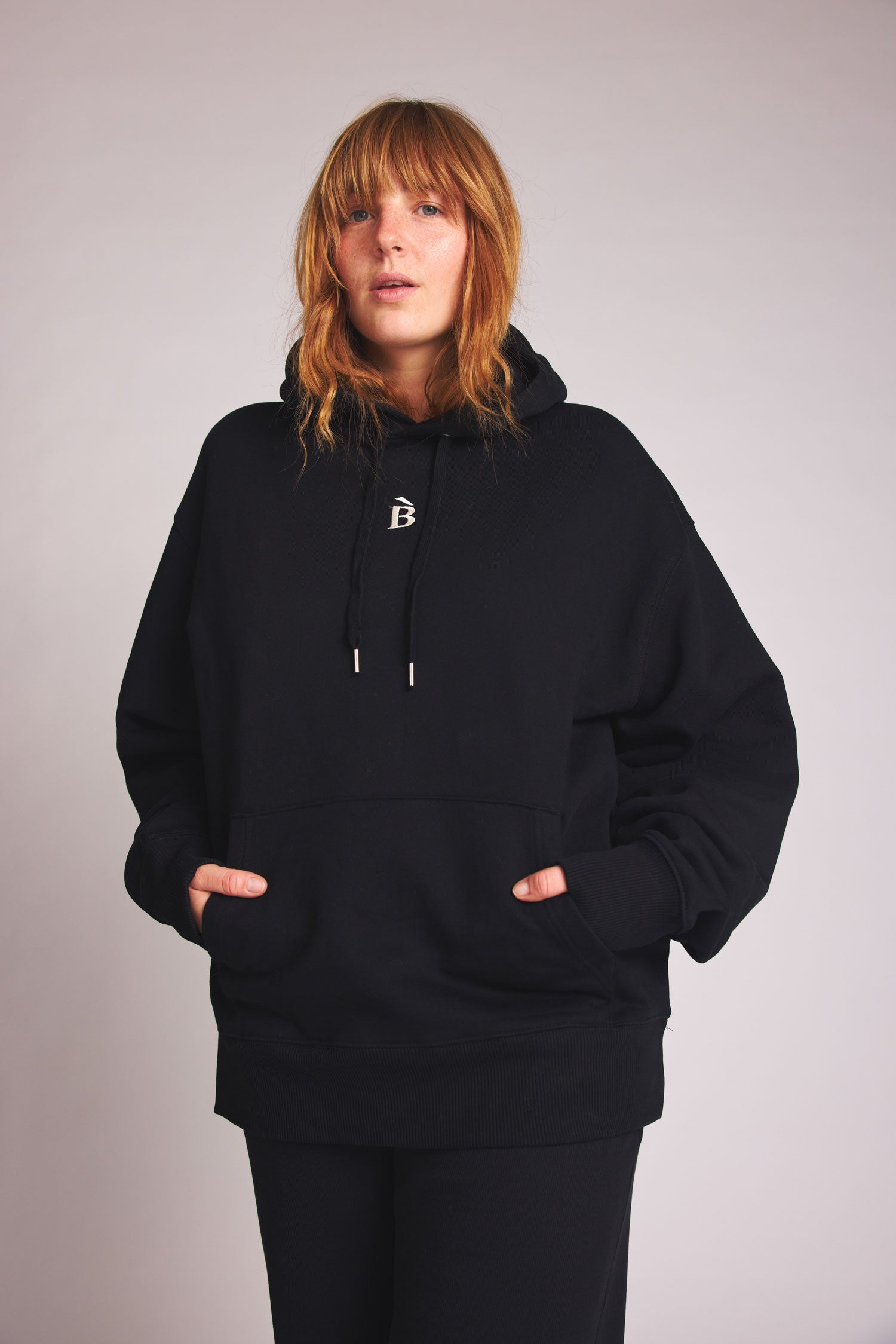 Black hoodie B-Stick made from 100% organic cotton by Baige the Label